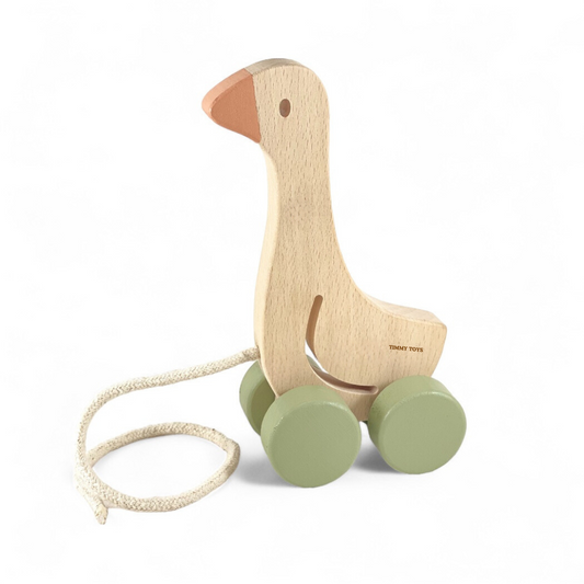 Charming Timmy Toys Little Goose Pull-Along Baby Wooden Toy with outstretched neck and playful eyes, crafted from durable beech wood, waddling alongside toddlers to enhance motor skills and spark imaginative play.