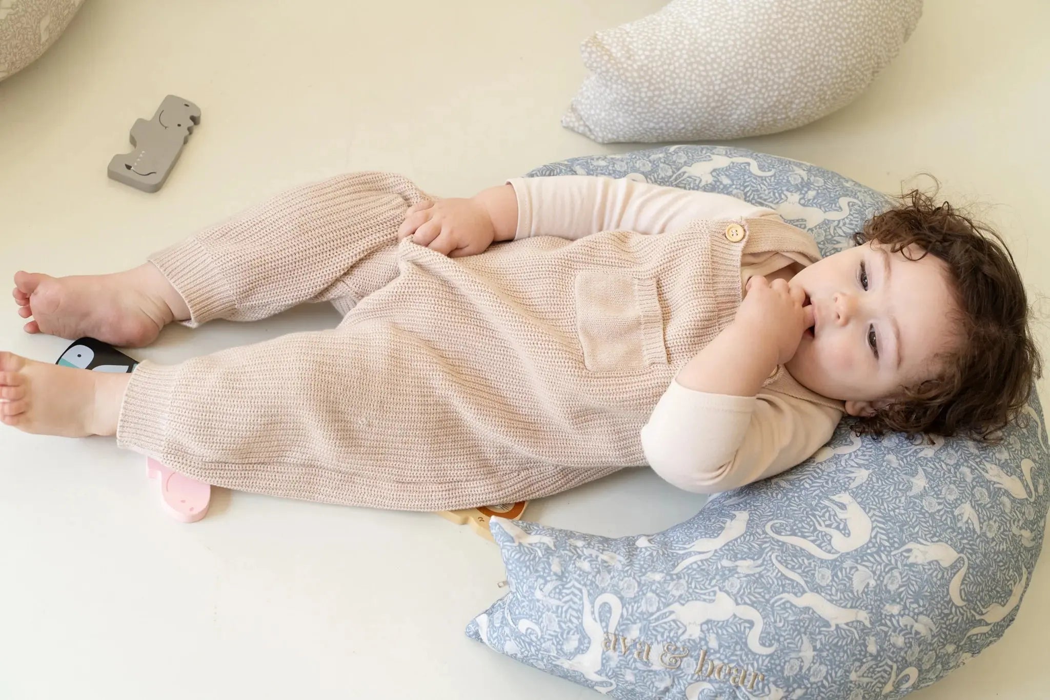 Ava & Bear Crescent nursing cushion for a blog about the benefits of nursing cushions