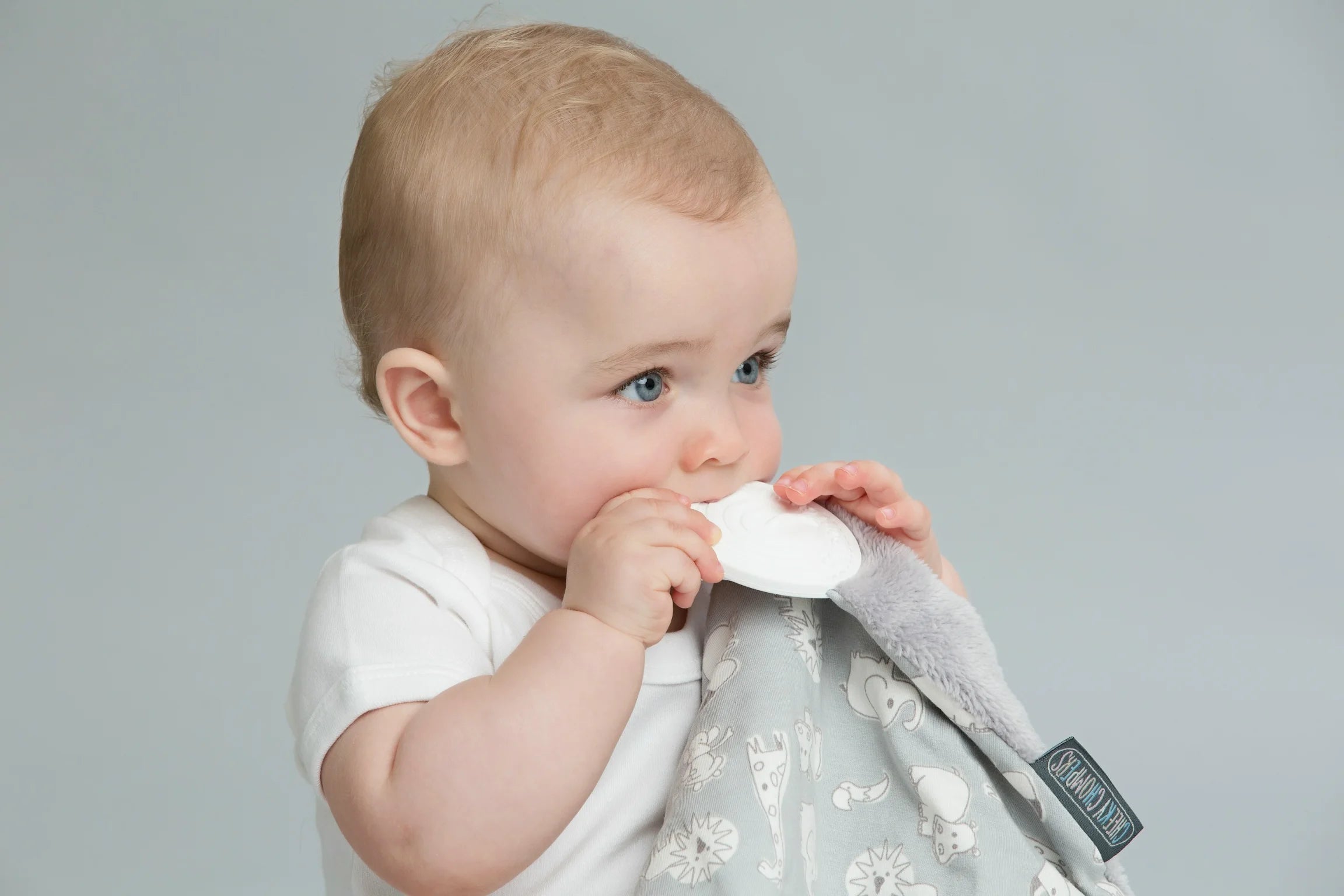 Baby biting a blanket - soothing teething naturally