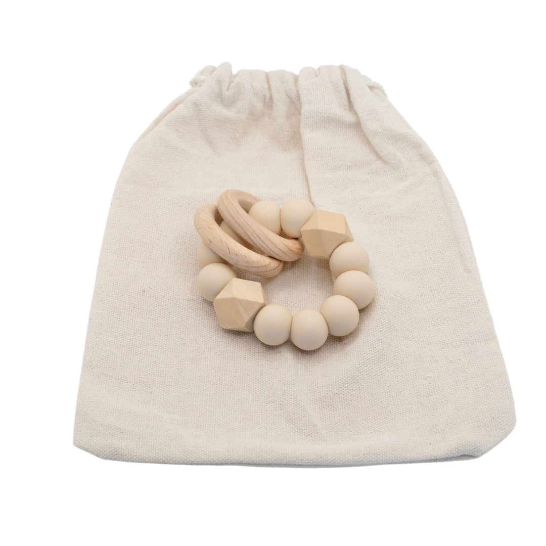 Ava & Bear Teether Toy and Dummy Clip Set featuring a handcrafted design with safe, BPA-free materials, showcasing a soothing silicone and wood texture perfect for easing teething discomfort, with a durable nylon cord for added resilience.