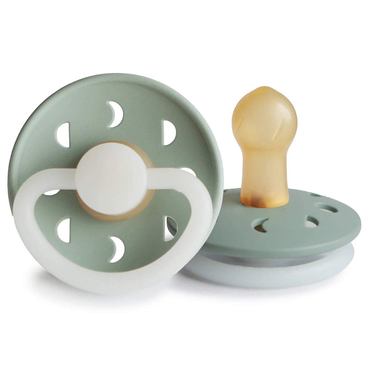 FRIGG Moon Night Pacifier by Ava & Bear, glowing softly with lunar phase designs, creating a serene atmosphere for your child's restful sleep.