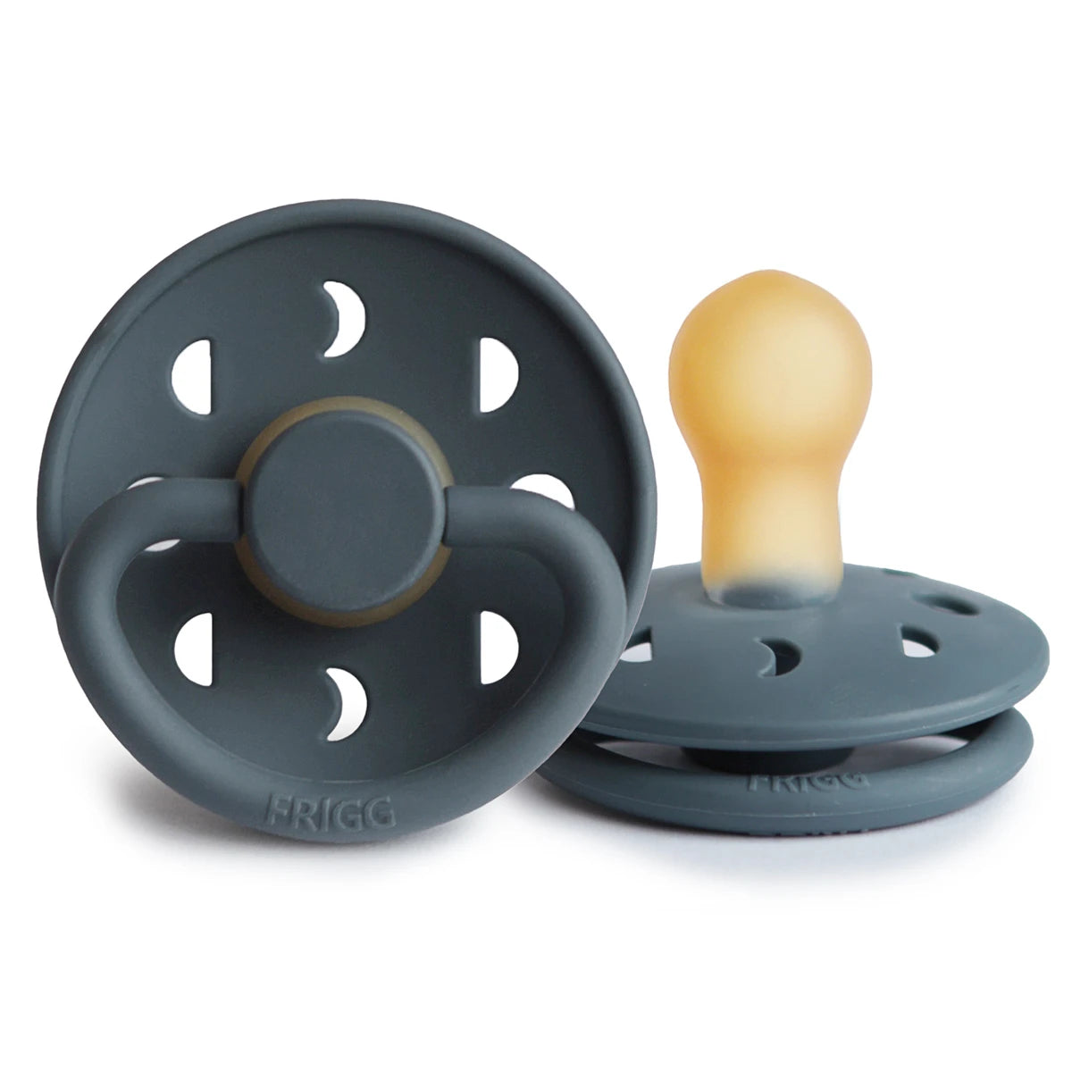 Celestial-themed FRIGG Moon pacifier by Ava & Bear, showcasing a soothing lunar design that adds a comforting glow to your baby's crib environment.